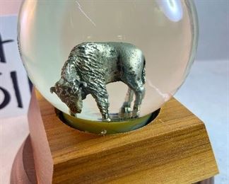 Lot 5161.  $27.00. "You cannot roller skate in a buffalo herd..." but you can own a carved buffalo horn bird on a branch! We will include this pewter Buffalo incased in glass and a metal western cup. 