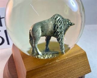 Lot 5161.  $27.00. "You cannot roller skate in a buffalo herd..." but you can own a carved buffalo horn bird on a branch! We will include this pewter Buffalo incased in glass and a metal western cup. 