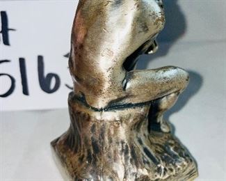 Lot 5163. $60.00  Bronze Old World Gnome figure with his head between his knees and his hands holding his face!  4.5"x4"h, and he is heavy.  Next is a metal replica of Rodan's "The Thinker."   He seems to be contemplating nature from another time and place.  4.5"h x 2.25"w. 