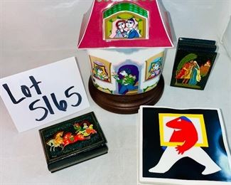 Lot 5165. $95.00. Bjorn Wiinblad for Rosenthal's studio-linie, made in Germany covered porcelain jar "Scenes from a Window" series. Covered box with a Dutch inscription on the back. Two black lacquered hinged boxes (2.75"l x 2"w)