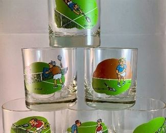 Lot 5166. $88.00. Tennis: The game where love measures nothing! This lot is made up of a mix for apres the match. A pewter Kelermes from Sheffield 6oz hip flask with a Tennis player, and 6 vintage Ashby tennis low ball glasses will help things get started, then admire an Orrefors crystal tennis ball 3.5"dia. 