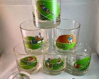 Lot 5166. $88.00. Tennis: The game where love measures nothing! This lot is made up of a mix for apres the match. A pewter Kelermes from Sheffield 6oz hip flask with a Tennis player, and 6 vintage Ashby tennis low ball glasses will help things get started, then admire an Orrefors crystal tennis ball 3.5"dia. 