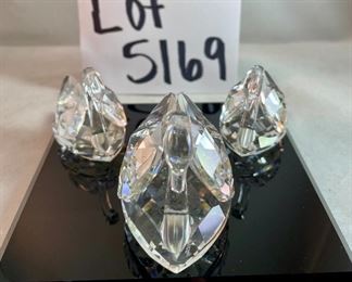 Lot 5169. $70.00. Lot of 3 signature Swarovski crystal swans. No box, need to be cleaned. Largest: 1.5"h x 1.75"w x 3"d, two smaller: 1.25"h x 1.25"w x 2"d