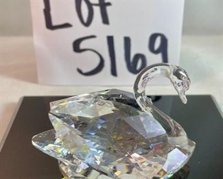 Lot 5169. $70.00. Lot of 3 signature Swarovski crystal swans. No box, need to be cleaned. Largest: 1.5"h x 1.75"w x 3"d, two smaller: 1.25"h x 1.25"w x 2"d