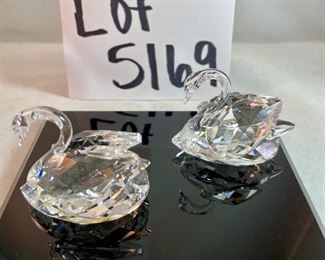 Lot 5169. $70.00. Lot of 3 signature Swarovski crystal swans. No box, need to be cleaned. Largest: 1.5"h x 1.75"w x 3"d, two smaller: 1.25"h x 1.25"w x 2"d