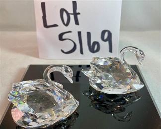 Lot 5169. $70.00. Lot of 3 signature Swarovski crystal swans. No box, need to be cleaned. Largest: 1.5"h x 1.75"w x 3"d, two smaller: 1.25"h x 1.25"w x 2"d