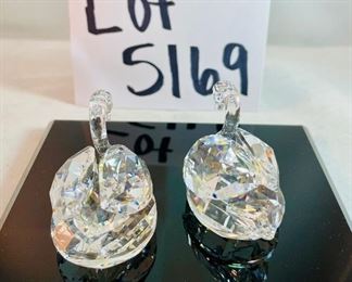 Lot 5169. $70.00. Lot of 3 signature Swarovski crystal swans. No box, need to be cleaned. Largest: 1.5"h x 1.75"w x 3"d, two smaller: 1.25"h x 1.25"w x 2"d