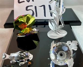 Lot 5171. $62.00. Sea Creatures from Crystal Zoo by Swarovski. The sea horse riding a wave is about 3"tall. Cute clownfish 2"x2"x1", Small fish 1", and an unmarked clam shell w/pearl. 