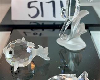 Lot 5171. $62.00. Sea Creatures from Crystal Zoo by Swarovski. The sea horse riding a wave is about 3"tall. Cute clownfish 2"x2"x1", Small fish 1", and an unmarked clam shell w/pearl. 
