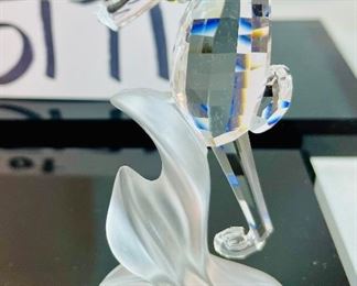 Lot 5171. $62.00. Sea Creatures from Crystal Zoo by Swarovski. The sea horse riding a wave is about 3"tall. Cute clownfish 2"x2"x1", Small fish 1", and an unmarked clam shell w/pearl. 