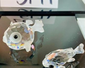 Lot 5171. $62.00. Sea Creatures from Crystal Zoo by Swarovski. The sea horse riding a wave is about 3"tall. Cute clownfish 2"x2"x1", Small fish 1", and an unmarked clam shell w/pearl. 