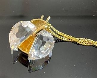 Lot 5172. $40.00. Swarovski Crystal Memories Lady Bug necklace and 2 fun crystal spiders.  The necklace comes in a gift box and has a Swarovski Branded 20" chain