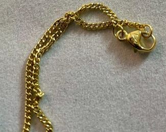 Lot 5172. $40.00. Swarovski Crystal Memories Lady Bug necklace and 2 fun crystal spiders.  The necklace comes in a gift box and has a Swarovski Branded 20" chain