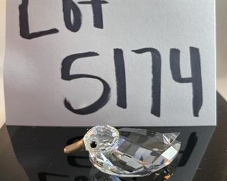 Lot 5174. $36.00. A lot of Crystal Miniatures. 1)Crystal Zoo duck w/pewter bill (has been repaired), 2)Crystal caravan hummingbird 1.5"h. 3)Faceted Bird in mirror base 1"tall. 4)crystal hummingbird w/porcelain flower 2"l x 1"h unmarked