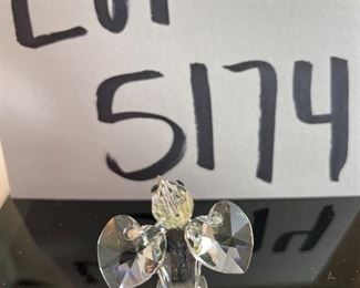 Lot 5174. $36.00. A lot of Crystal Miniatures. 1)Crystal Zoo duck w/pewter bill (has been repaired), 2)Crystal caravan hummingbird 1.5"h. 3)Faceted Bird in mirror base 1"tall. 4)crystal hummingbird w/porcelain flower 2"l x 1"h unmarked