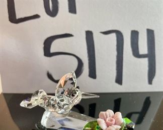 Lot 5174. $36.00. A lot of Crystal Miniatures. 1)Crystal Zoo duck w/pewter bill (has been repaired), 2)Crystal caravan hummingbird 1.5"h. 3)Faceted Bird in mirror base 1"tall. 4)crystal hummingbird w/porcelain flower 2"l x 1"h unmarked