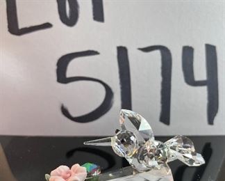 Lot 5174. $36.00. A lot of Crystal Miniatures. 1)Crystal Zoo duck w/pewter bill (has been repaired), 2)Crystal caravan hummingbird 1.5"h. 3)Faceted Bird in mirror base 1"tall. 4)crystal hummingbird w/porcelain flower 2"l x 1"h unmarked