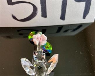 Lot 5174. $36.00. A lot of Crystal Miniatures. 1)Crystal Zoo duck w/pewter bill (has been repaired), 2)Crystal caravan hummingbird 1.5"h. 3)Faceted Bird in mirror base 1"tall. 4)crystal hummingbird w/porcelain flower 2"l x 1"h unmarked