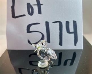 Lot 5174. $36.00. A lot of Crystal Miniatures. 1)Crystal Zoo duck w/pewter bill (has been repaired), 2)Crystal caravan hummingbird 1.5"h. 3)Faceted Bird in mirror base 1"tall. 4)crystal hummingbird w/porcelain flower 2"l x 1"h unmarked