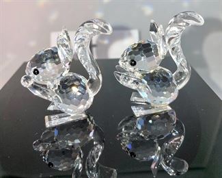 Lot 5177. $42.00. Woodland fun Crystal critters. No boxes. 2 Crystal Zoo by Swarovski squirrels 1.5"h x 1"w, and a larger bunny on crystal base. 2.5"h x 1.75"w (sold as is, is it missing arms? I don't know!).
