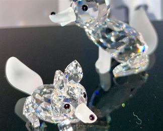 Lot 5178. $43.00. 3 crystal foxes. The Large and Small fox from Crystal Zoo by Swarovski have frosted tails and snouts, both are signed. The 3rd fox looks a little down but is made of faceted crystals on a base (2"h) 