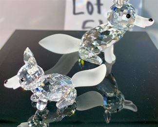 Lot 5178. $43.00. 3 crystal foxes. The Large and Small fox from Crystal Zoo by Swarovski have frosted tails and snouts, both are signed. The 3rd fox looks a little down but is made of faceted crystals on a base (2"h) 