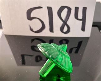 Lot 5184. $70.00.  Oh la la! An Emerald Lalique "Toupie" Spinning Top, it is signed on the stem. We have 1 of the Emerald colored top, includes a branded box and string suede bag. 1.25"h x 1.5"w.