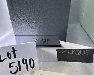 Lot 5190. $225.00. Lalique "Mirabel" Perfume Bottle, in frosted crystal Amber-ish glass. Signed. Brand new, was shrink-wrapped, but we wanted to make sure the markings on the outside matched, the item, so we opened the shrink wrap.  Stunning. Includes Box, outer sleeve, and all insert cards.  1 Mirabel Falcon 11208. Made in France	6"x4.75" roughly