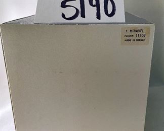 Lot 5190. $225.00. Lalique "Mirabel" Perfume Bottle, in frosted crystal Amber-ish glass. Signed. Brand new, was shrink-wrapped, but we wanted to make sure the markings on the outside matched, the item, so we opened the shrink wrap.  Stunning. Includes Box, outer sleeve, and all insert cards.  1 Mirabel Falcon 11208. Made in France	6"x4.75" roughly