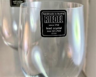 Lot 5199. Choose your own adventure wine glasses.  2 substantial Sommeliers Riedel wine glasses (10.74"t x 3"w at opening) and 2 smaller Reidel (8.25" x 2.5" opening). The smaller glasses have the vintage Riedel Brand on the base. 