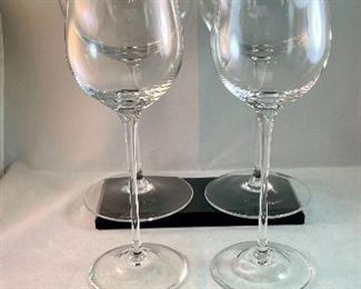 Lot 5199. $72.00. Choose your own adventure wine glasses.  2 substantial Smolleliers Reidel glasses (10.74"t x 3"w at opening) and 2 smaller Reidel (8.25" x 2.5" opening). The smaller glasses have the vintage Reidel Brand on the base. 