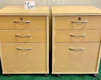 Lot 5204. $190.00 for 2 Birch Color Wood File Cabinets. 2 pencil drawers, 1 file drawer w/lock and key. on casters. 19" W  x 18" D x 26" H. Very attractive Pair of Cabinets. 