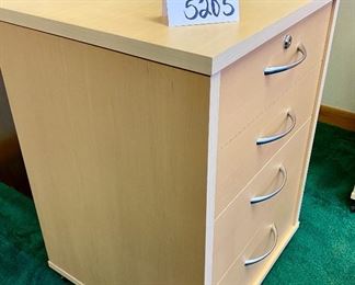 Lot 5205. $95.00 4 Drawer Birch Color Wood Cabinet  w/lock and key on casters. 19" W  x 18" D x 26" H. Very attractive cabinet.