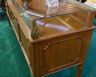 Lot 5210.  $1,200.00   Vintage Wood Display Case w/glass enclosure. This is one of our favorites from the Sale.  Awesome details (look at those corners!), 4 Doors to access display, 9 drawer storage. Perfect for an Antique/Jewelry/Collectibles.	73" L x 22" D  x 35.5" H