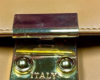 Lot 5215. $38.00. Unbranded Brown Leather Clutch with "Italy" buckle and combination. Condition as shown. Made in Italy? 10"w x 6"tx2"d