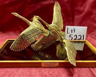 Lot 5221. $75.00. 3 Geese in Flight Brass Sculpture 10"w x 9"d x7"t. The Flight by Gunther R Granget, wood base w/mirror. 1981. Cast with 24 karat gold vermeil over solid American pewter. No box included.	15"w x 7.25"d