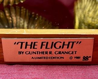 Lot 5221. $75.00. 3 Geese in Flight Brass Sculpture 10"w x 9"d x7"t. The Flight by Gunther R Granget, wood base w/mirror. 1981. Cast with 24 karat gold vermeil over solid American pewter. No box included.	15"w x 7.25"d