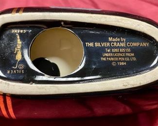 Lot 5225.  $90.00  Vintage 1984  Silver Crane Co. for ParkerPen Company.  Fountain Pens are Hot right now.  Very Cool Fountain Pen Display, Black & Gold. Ceramic with Strorage.  Great display for a pen collector! 	14" L  x  3.5" W x 3.5" H