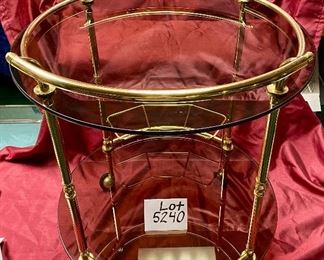 Lot 5240. $175.00 Vintage MCM Bar Cart on rubber castors. Brass and dark smoked glass, 2 tier with 3 bottle holders on the lower level. 27.5" H x 22"diameter. Handle to Handle: 23" W.  Scroll down to Lot 5240 for more photos.