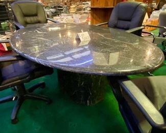 Lot 5008 $700.00  5'10" Black Oval Conference Table, metal with marble look and matching base. 44" W  x 70" L X 30" H. Solid construction with a modern look.  Chairs are in a separate lot.  