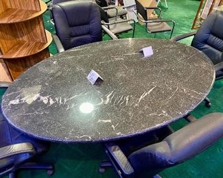 Lot 5008 $700.00  5'10" Black Oval Conference Table, metal with marble look and matching base. 44" W  x 70" L X 30" H. Solid construction with a modern look.  Chairs are in a separate lot.  