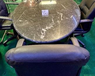 Lot 5008 $700.00  5'10" Black Oval Conference Table, metal with marble look and matching base. 44" W  x 70" L X 30" H. Solid construction with a modern look.  Chairs are in a separate lot.  