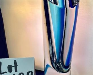 Lot 5128. $300.00. Kosta Boda Swedish Studio Art Glass pair, the first item is a Kosta Boda  by Gorän Warff Crystal Vase with contemporary beautiful lines and striking colors (11"t x 4"w) #49809, and a Kosta Boda heart beat art glass paperweight (3"x3"x1") by Bertil Vallien #90117 (both with boxes)