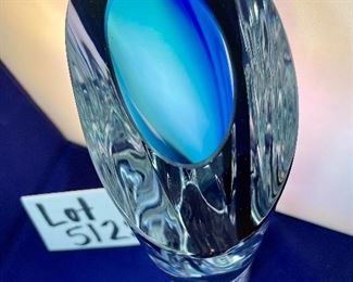 Lot 5128. $300.00. Kosta Boda Swedish Studio Art Glass pair, the first item is a Kosta Boda  by Gorän Warff Crystal Vase with contemporary beautiful lines and striking colors (11"t x 4"w) #49809, and a Kosta Boda heart beat art glass paperweight (3"x3"x1") by Bertil Vallien #90117 (both with boxes)