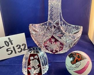Lot 5132. $45.00  Ruby and Clear Paperweight Cut glass, nice and sharp (3" W x 3" H x 2" D), Ruby and Clear Crystal Handled Basket (7.5". H x 8" W x 4.5" D), Art Glass Paperweight.