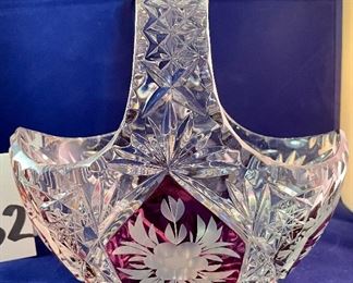 Lot 5132. $45.00  Ruby and Clear Paperweight Cut glass, nice and sharp (3" W x 3" H x 2" D), Ruby and Clear Crystal Handled Basket (7.5". H x 8" W x 4.5" D), Art Glass Paperweight.