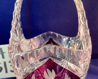 Lot 5132. $45.00  Ruby and Clear Paperweight Cut glass, nice and sharp (3" W x 3" H x 2" D), Ruby and Clear Crystal Handled Basket (7.5". H x 8" W x 4.5" D), Art Glass Paperweight.