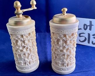 Lot 5137. $18.00  Set of faux bone carved Asian salt and pepper shaker. Intricate design. Pepper is missing the internal grinder. 5.5" H x  2" W
