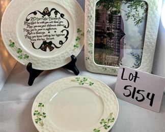 Lot 5154. $46.00. Belleek Ireland Trio. Includes: Small Shamrock Plate (7.25"dia), a sweet Marriage Blessings  Plate (8.5"),  and a Shamrock Picture Frame with a wood backing and 5x7" opening. 