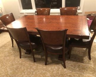 Dining Table comes with 8 total chairs and 2 extra table leaves.